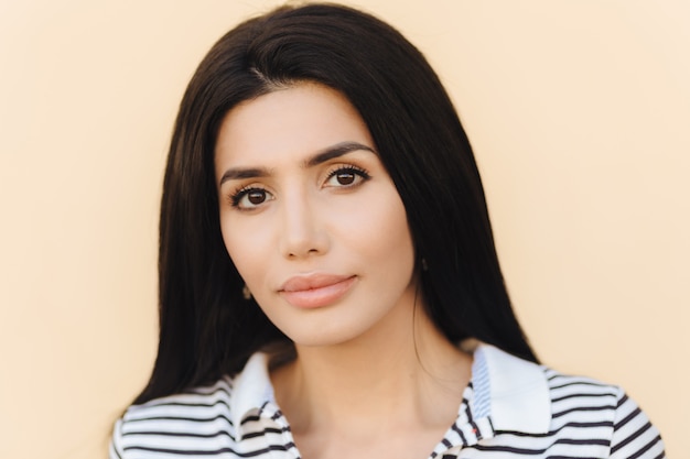 Close up portrait of brunette young female with healthy clean skin