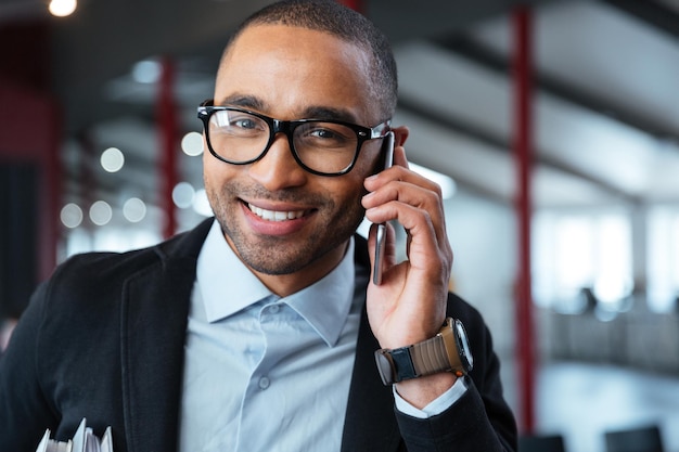 Close-up portrait of a businessman talking on the phone in the office