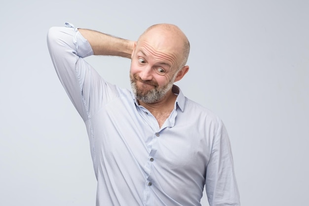 Close up portrait of a casual mature pensive businessman Studio shot