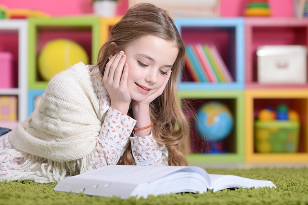 Close up portrait of cute happy girl studying at home