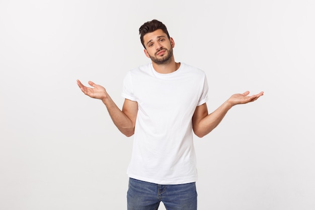 Close up portrait of disappointed stressed bearded young man in shirt over  