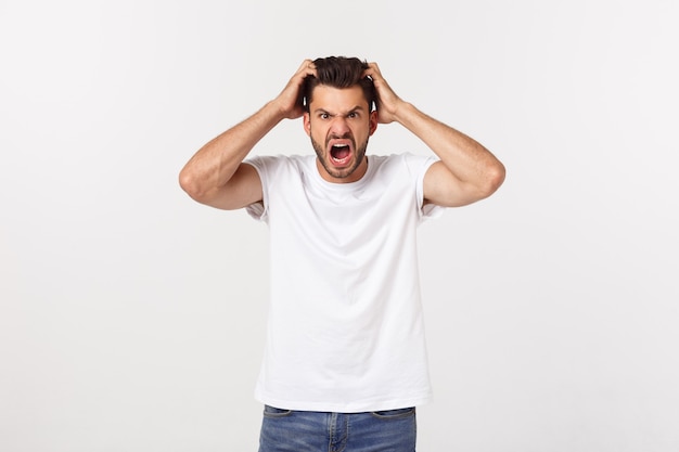 Close up portrait of disappointed stressed bearded young man in shirt over  