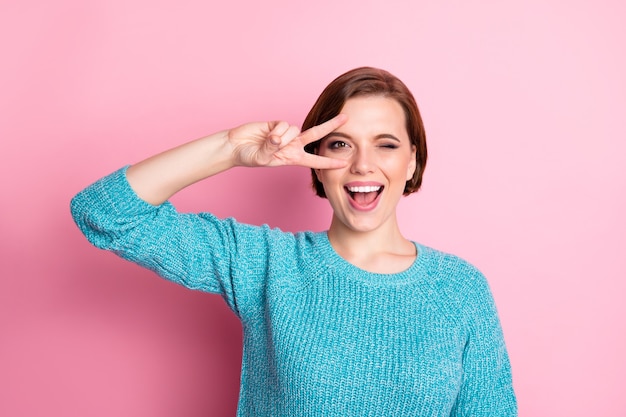 Close-up portrait of her she nice-looking attractive lovely cheerful cheery funky brown-haired woman enjoying showing v-sign having fun 