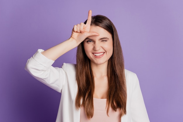 Close up portrait of lady finger forehead point up wear formal suit posing on purple wall