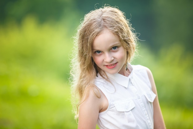 Close up portrait of little beautiful stylish kid girl on green background