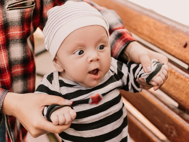 Close up portrait of little boy cute child having fun, playing making faces grimaces