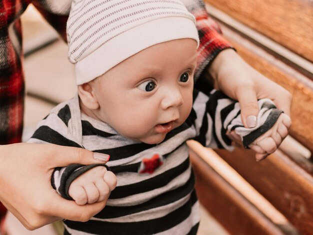 Close up portrait of little boy cute child having fun, playing making faces grimaces