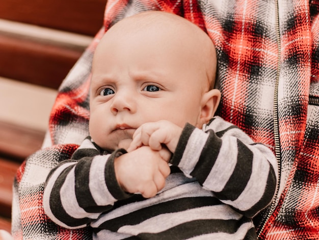 Close up portrait of little boy cute child having fun, playing making faces grimaces