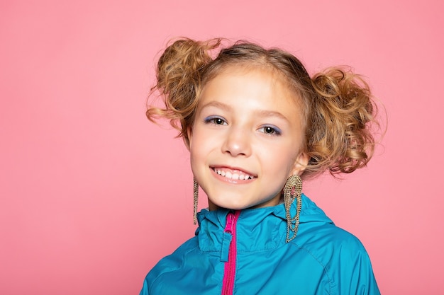 Close-up portrait of lovely sweet curious cheerful cheery smart clever girl isolated pink pastel color wall