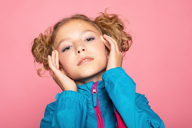 Close-up portrait of lovely sweet curious cheerful cheery smart clever girl isolated pink pastel color wall