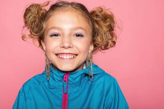 Close-up portrait of lovely sweet curious cheerful cheery smart clever girl isolated pink pastel color wall