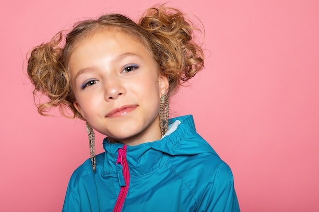 Close-up portrait of lovely sweet curious cheerful cheery smart clever girl isolated pink pastel color wall