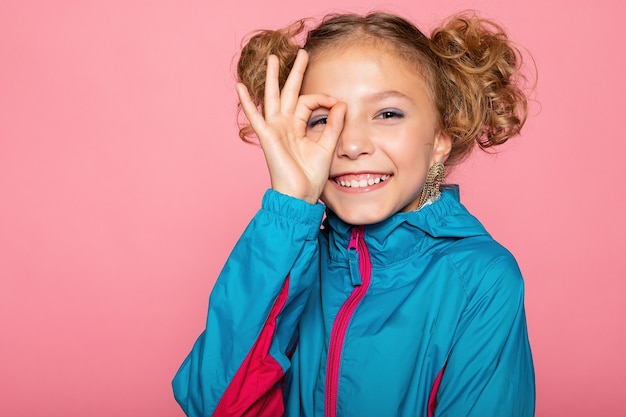 Close-up portrait of lovely sweet curious cheerful cheery smart clever girl isolated pink pastel color wall