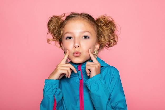 Close-up portrait of lovely sweet curious cheerful cheery smart clever girl isolated pink pastel color wall