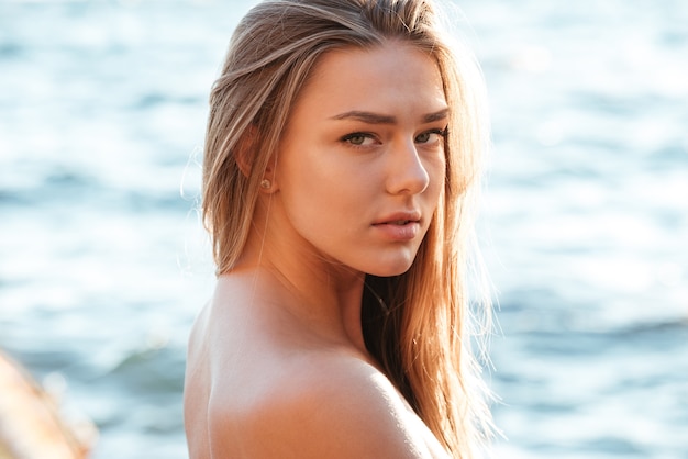 Close up portrait of model in swimsuit. so pretty girl. looking at front