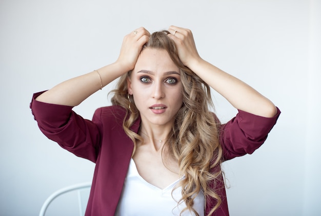 Close-up portrait of pretty attractive cheerful surprised wavy woman showing surprise gesture