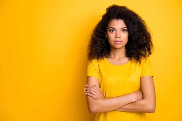 Close-up portrait of     pretty calm content serious   girl folded arms  