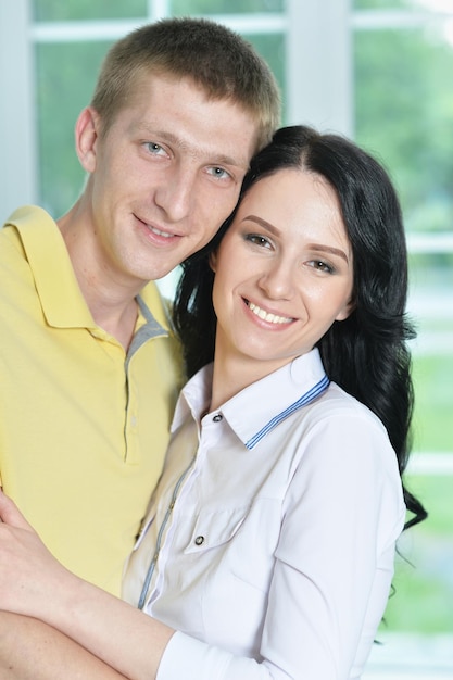 Close up portrait of pretty couple posing at home