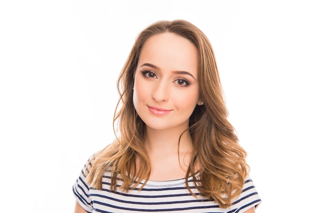 Close up portrait of pretty smiling young woman on white background