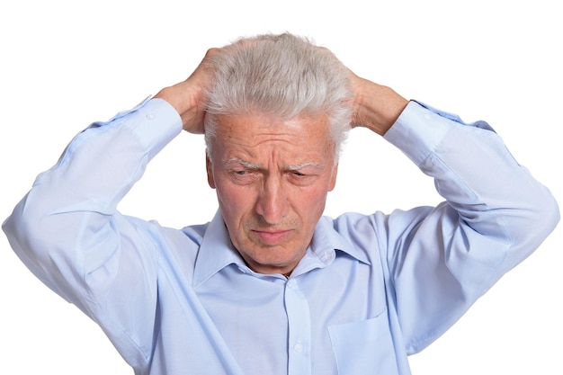 Close up portrait of sad senior man isolated on white background