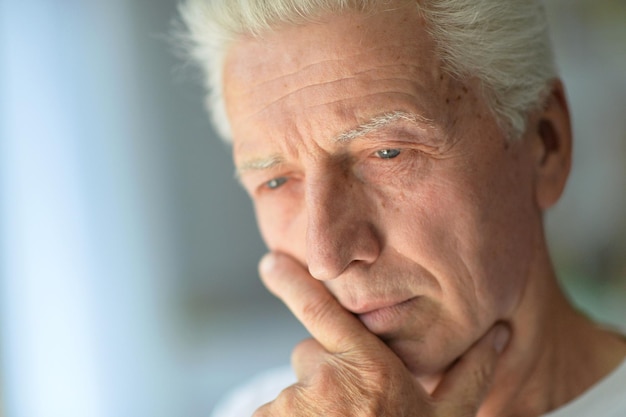 Close up portrait of a sad senior man