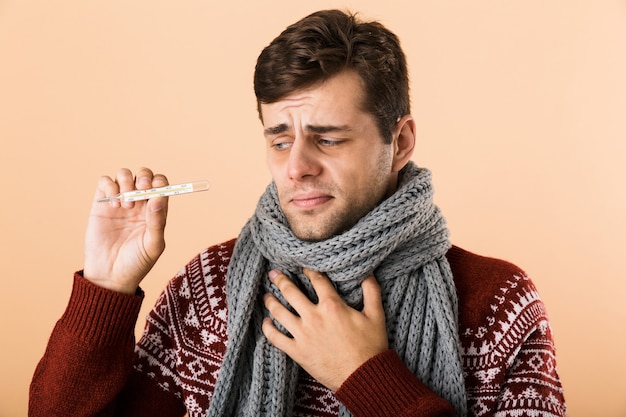 Close up portrait of a sad sick man dressed in sweater