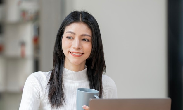 Close up portrait of smiling beautiful businesswoman or CEO sitting at office desk happy female boss posing making headshot confident successful woman at work