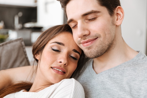 Close up portrait of a smiling young couple relaxing