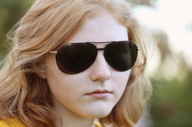 Close up portrait teenager girl in sunglasses