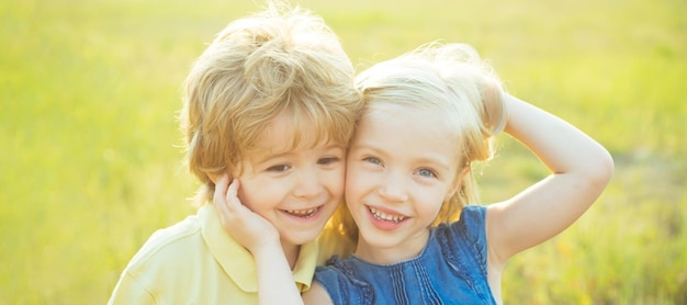 Close up portrait of two cute children outdoors spring banner for website header kids having fun in