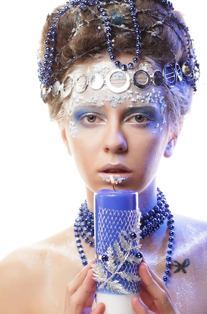 Close up portrait of winter queen with artistic make-up. Studio shot.