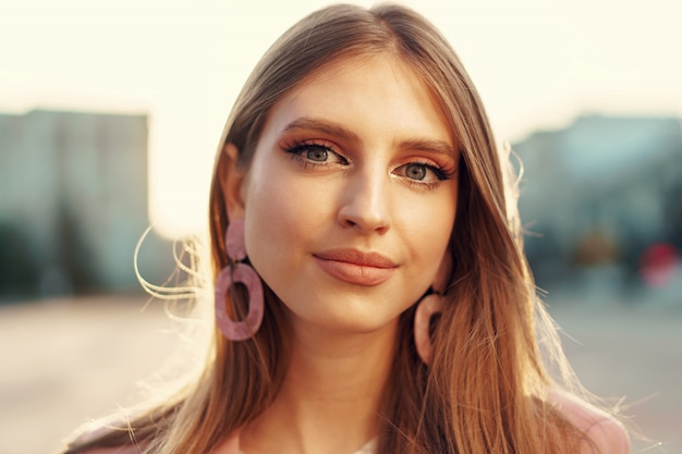 Close up portrait of a woman walking in the street