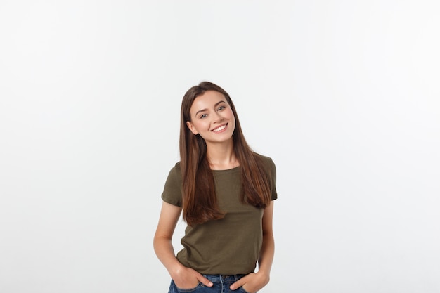 Close-up portrait of yong woman casual portrait in positive view, big smile, beautiful model posing in studio over white wall.