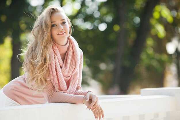 Close up portrait of young beautiful woman outdoors. Lady on spring . Attractive girl in autumn or fall Urban woman.