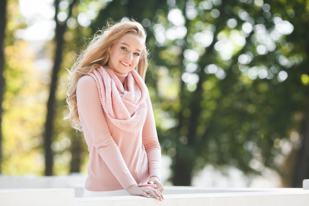 Close up portrait of young beautiful woman outdoors. Lady on spring . Attractive girl in autumn or fall Urban woman.