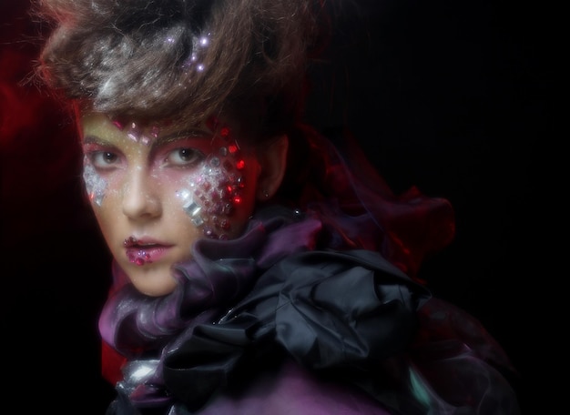 Close up portrait young woman with bright fantasy make up