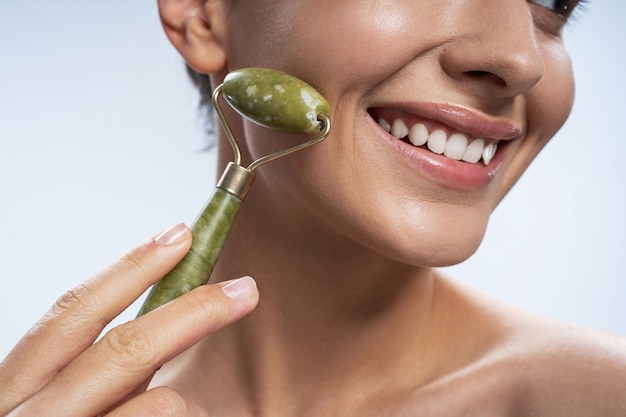 Close up of pretty girl that doing face massage