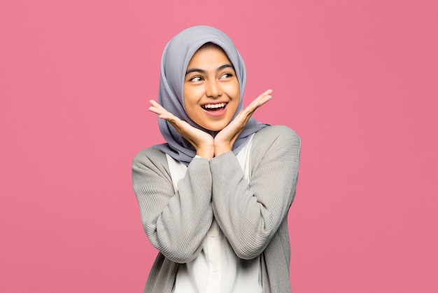 Close-up of pretty young Asian woman with happy expression