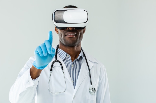 Close up of professional afro american doctor being involved in virtual reality