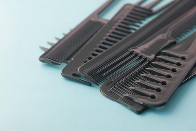 Close up of Professional combs on color background