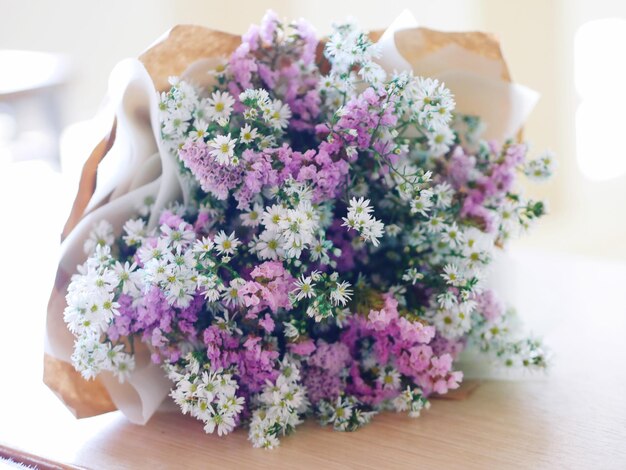 Close-up of purple flower bouquet on table