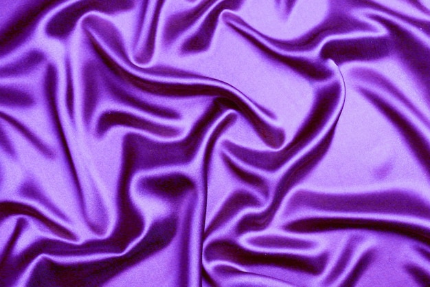 Close up purple toned abstract textile texture background