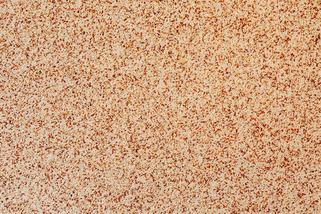 Close-up of putty with decorative brown sand.