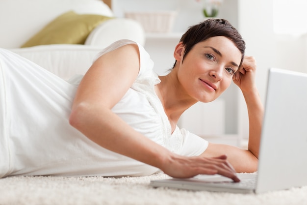 Close up of a quiet woman with a laptop