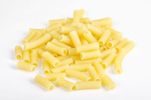 Close up of raw italian pasta on white