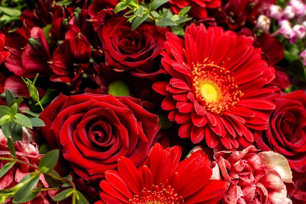 Close up of red bouquet flower with roses and gerberas.