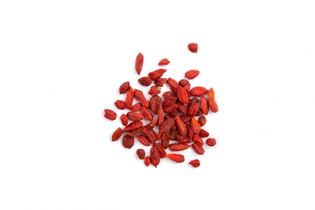 Close-up of red dried barberries on a bright background