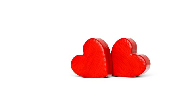 Photo close-up of red heart shapes over white background