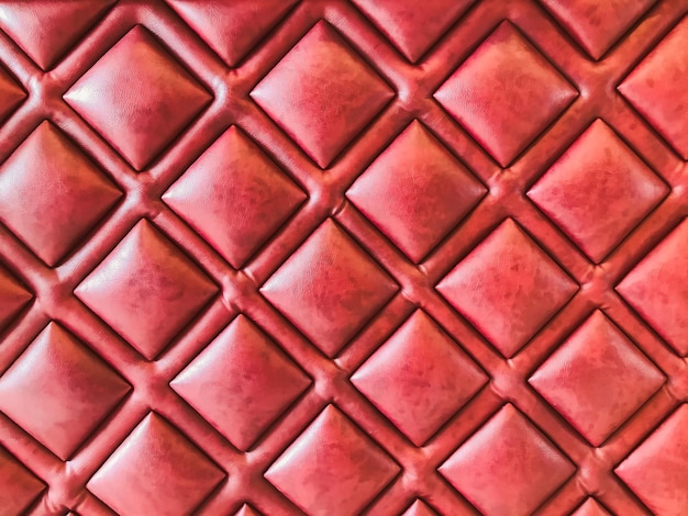 Close-up red leather sofa backrest background