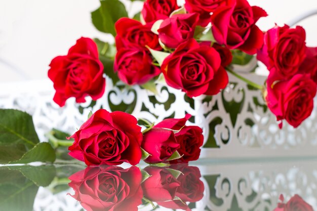 Close up on red roses bouquet on the table